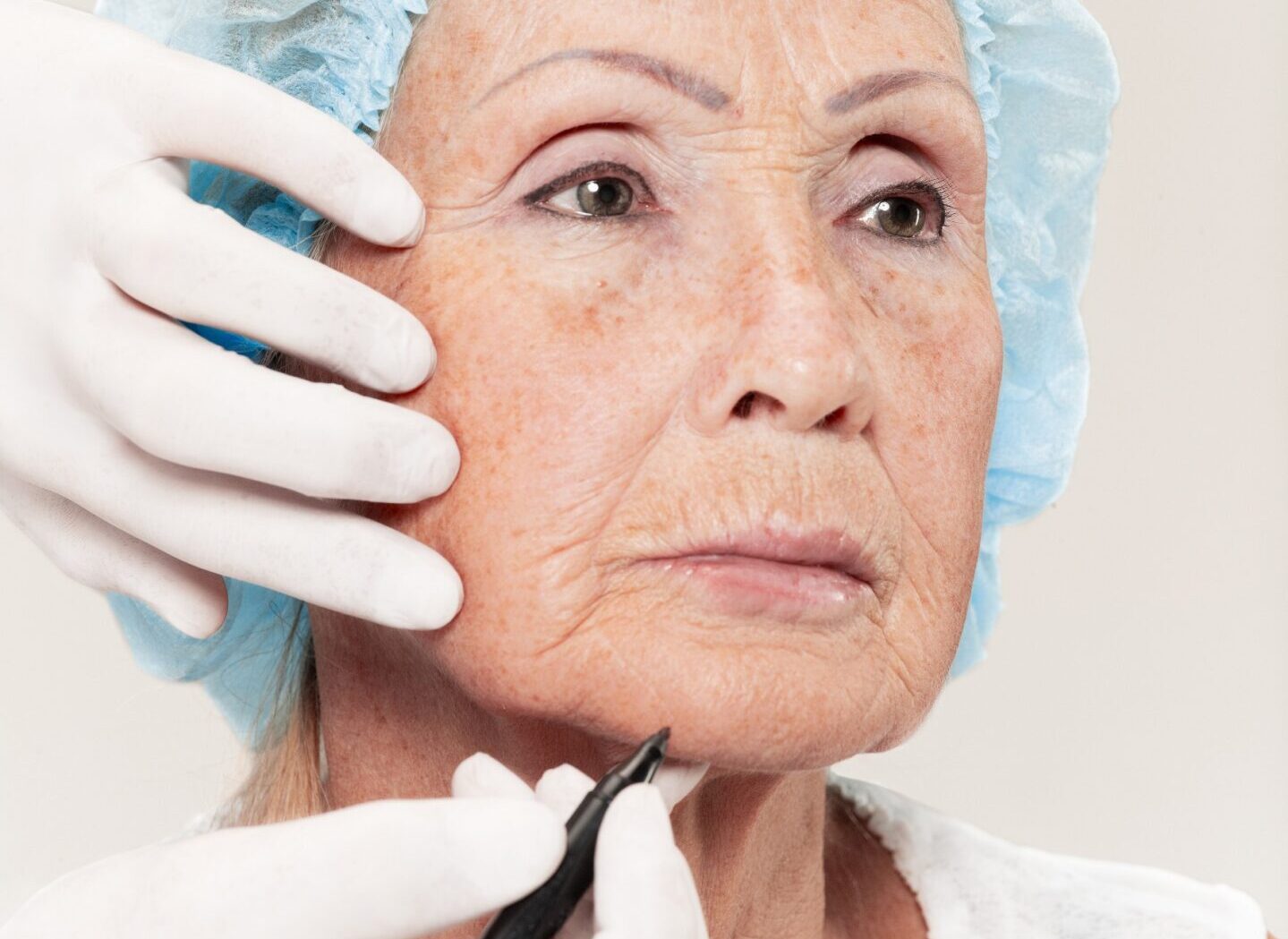 Close-up of a senior woman having her eyebrows permanent makeup done