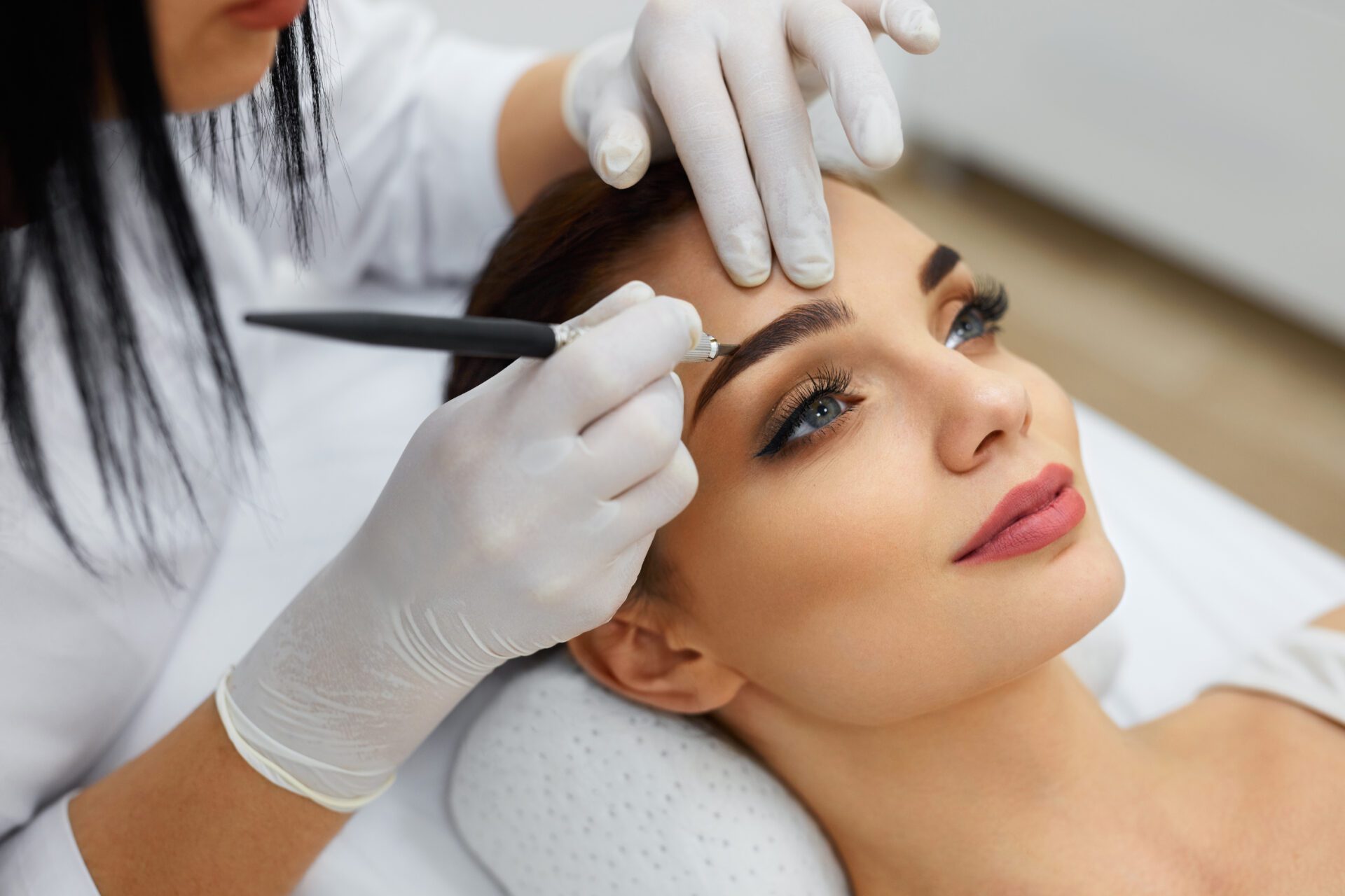 Beautician Doing Permanent Eyebrows Makeup