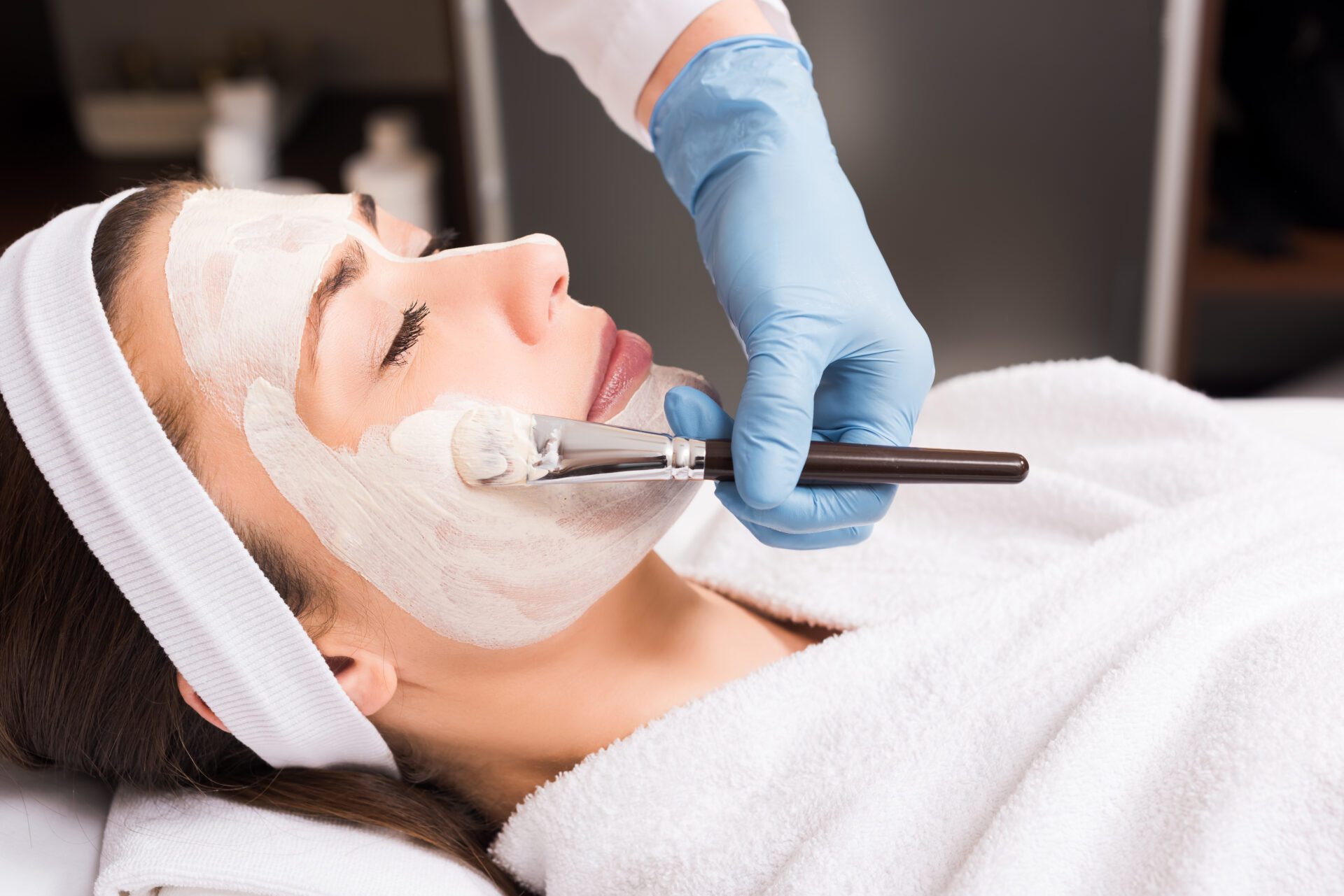 A woman getting a facial procedure on her face